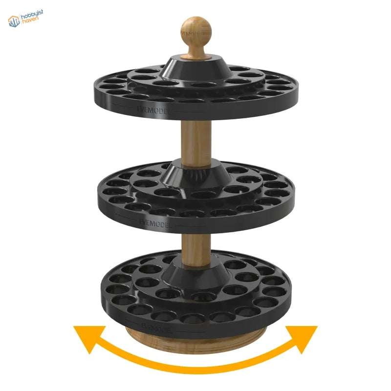 Three-tiered black plastic and wood-handled rotating paint bottle organizer with circular slots for vallejo and citadel bottles