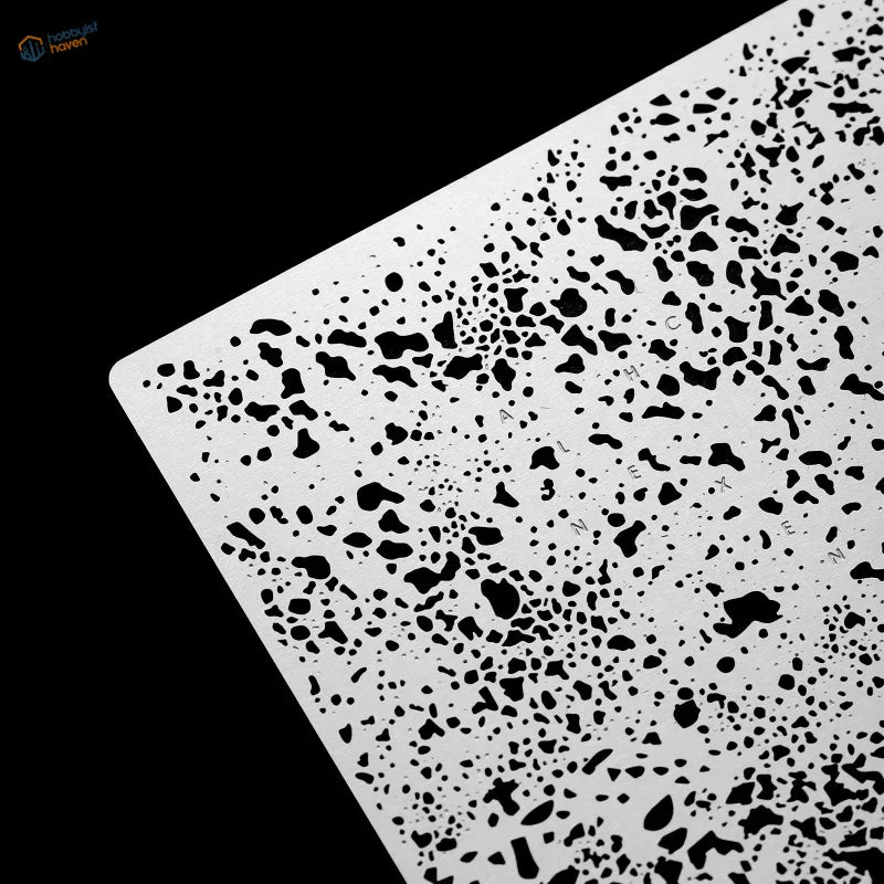 White plastic salt weathering corrosion stencil with black speckled terrazzo pattern for precision hobby tools