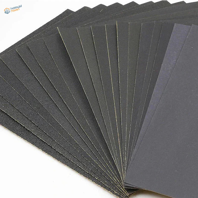 Premium sandpaper set with black abrasive sheets fanned out