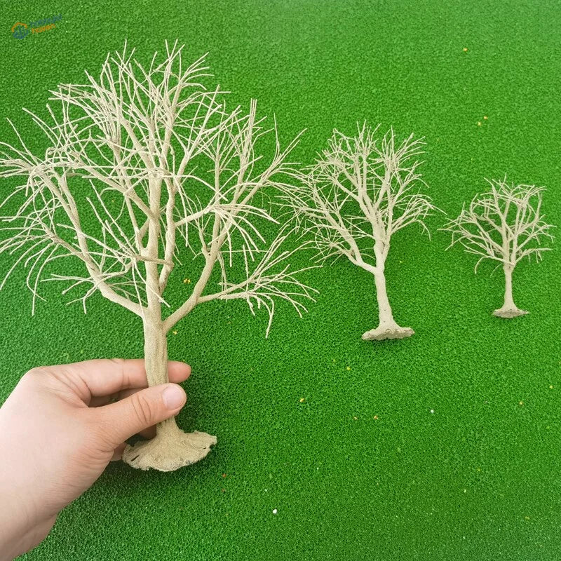 Beige plastic scale model trees with intricate branching designs