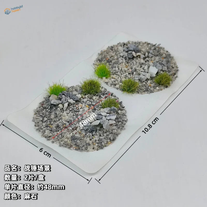 Scenic base toppers with gray gravel and green artificial grass tufts for miniature wargaming model building tools