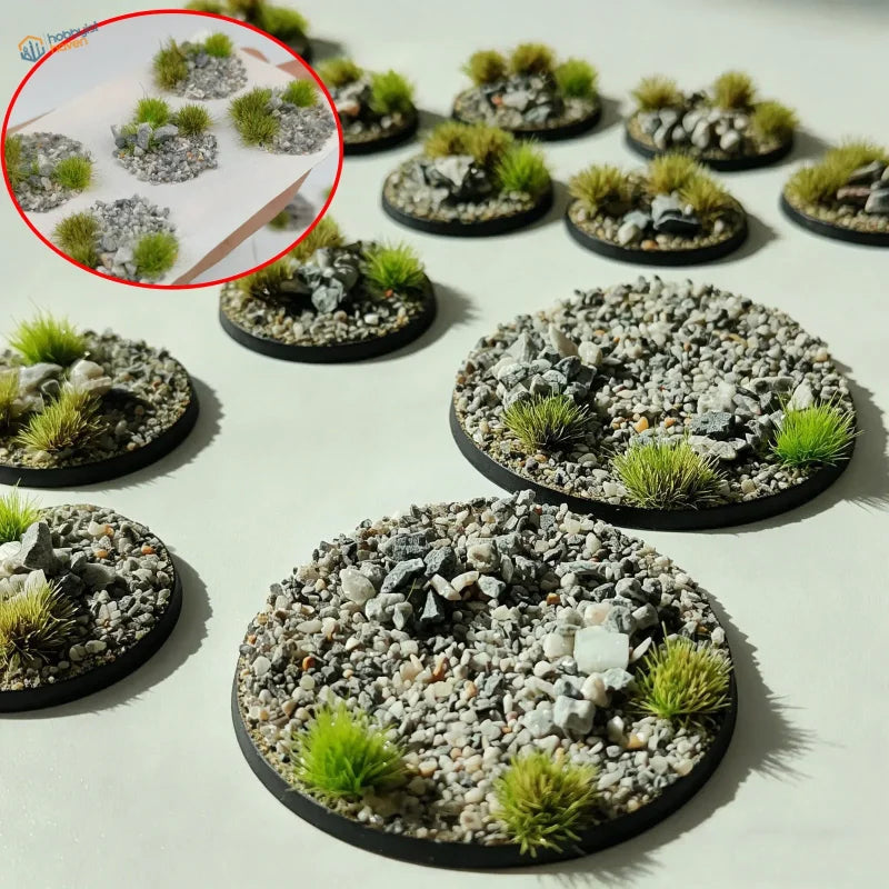 Circular black plastic base toppers featuring gray and white gravel with green grass for scale modeling tools
