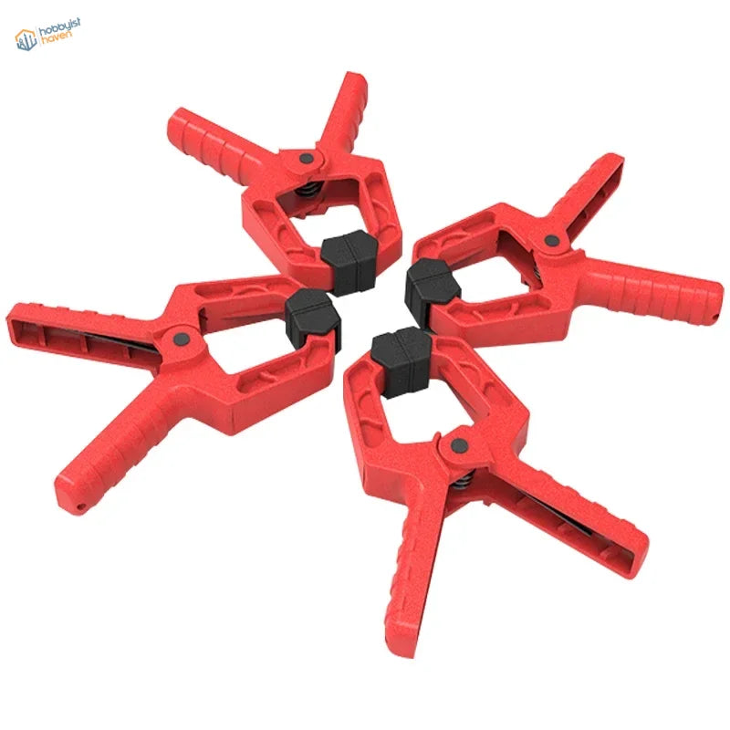 Red Seamless Clamps with black grips for scale modeling tools
