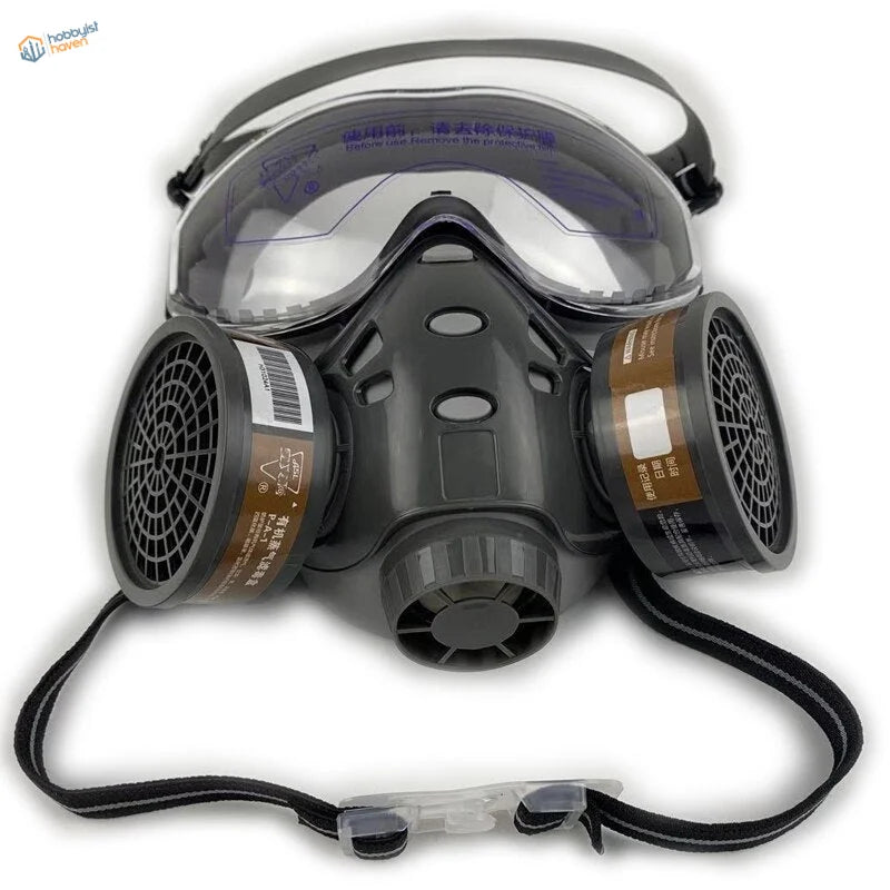 Black full-face dust mask with clear visor and filter cartridges