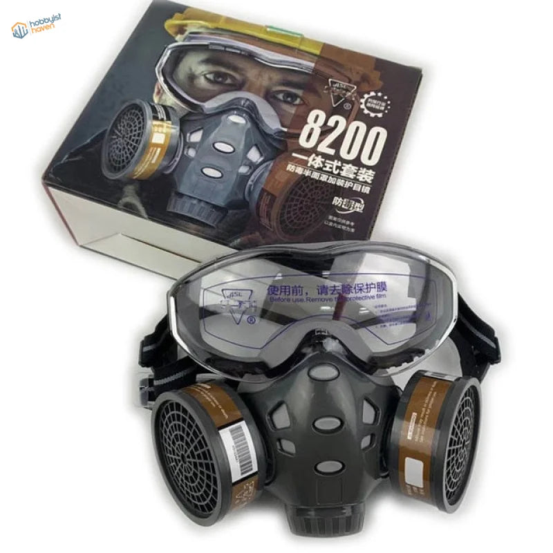 Black and gray face dust mask with goggles and brown filters