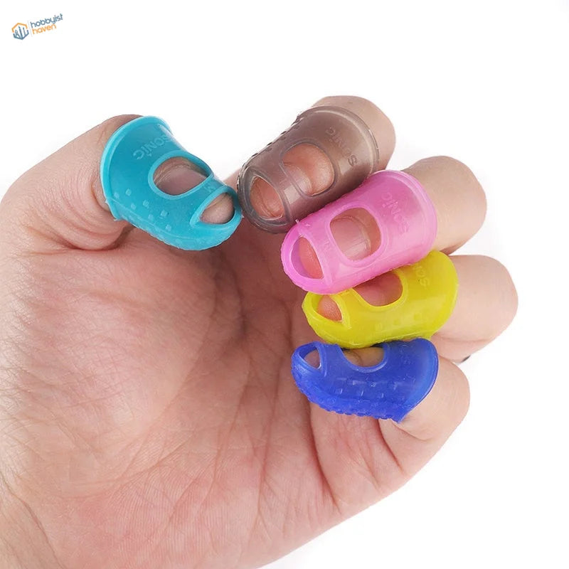Colorful silicone finger protectors in blue, pink, yellow, brown