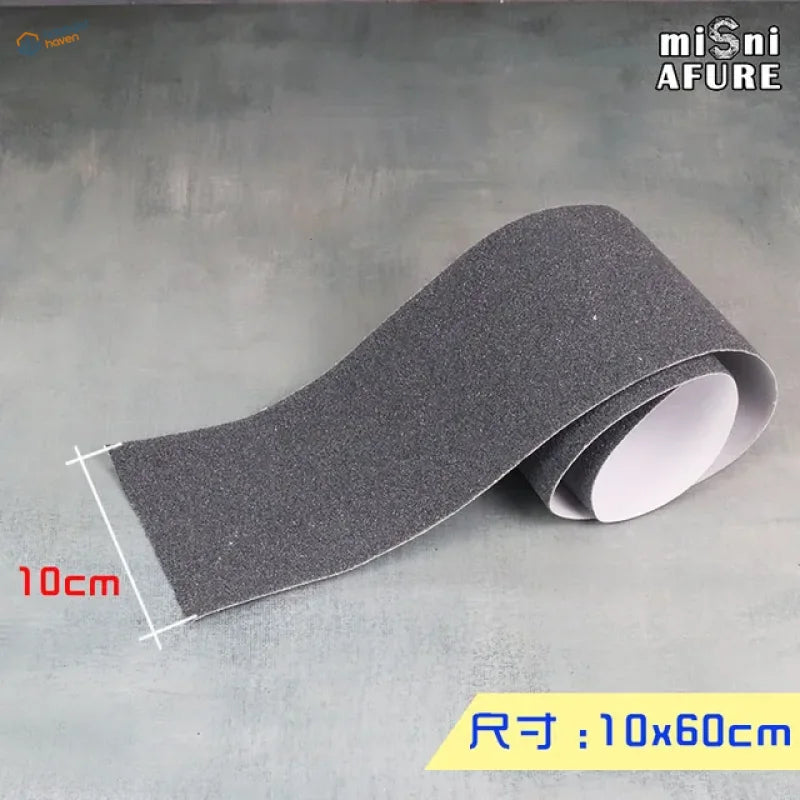 Dark gray textured Simulated Asphalt Stickers grip tape roll with white backing