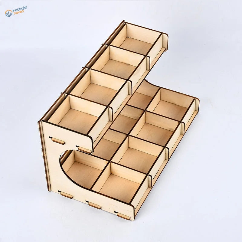 Light-colored small parts organizer rack with compartments and curved cutout