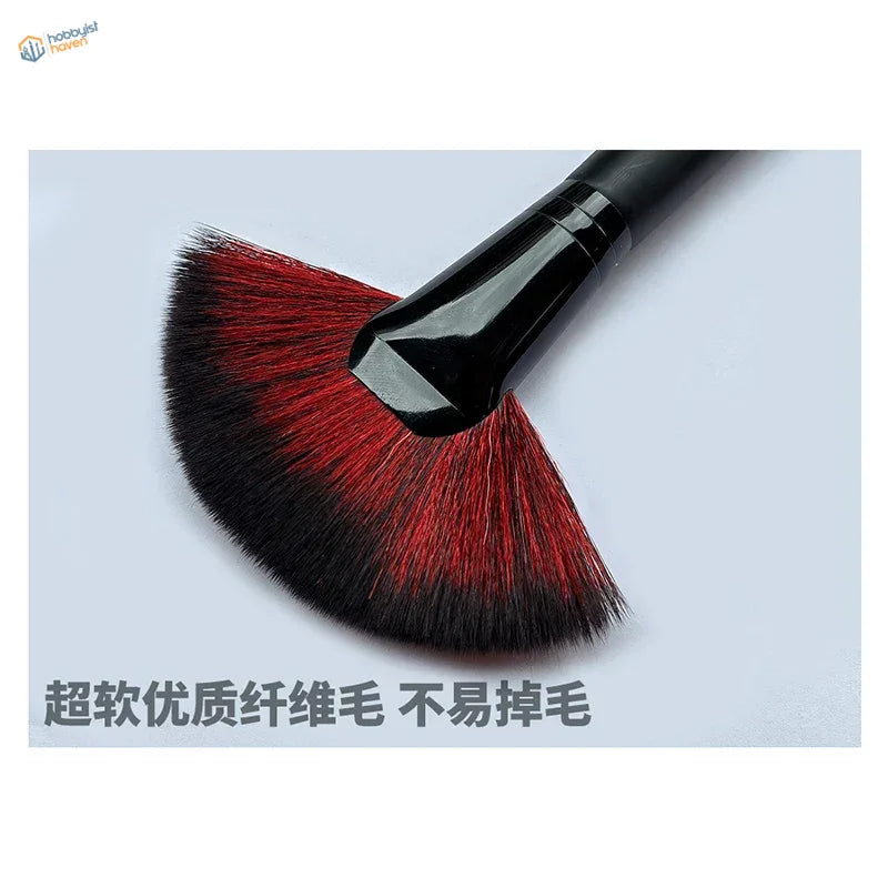 Soft fan model cleaning brush with sleek black handle and red-black bristles