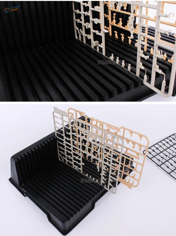 Black sprue holder with beige white resin parts for scale modeling tools