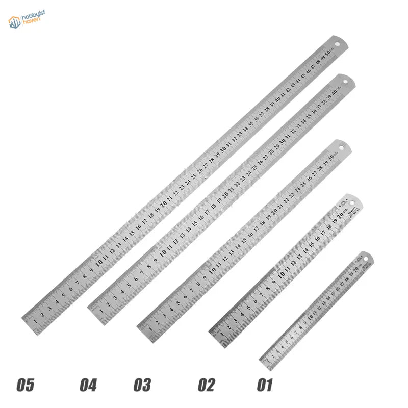 Set of five stainless steel rulers with precise engraved markings and hanging holes for scale modeling use