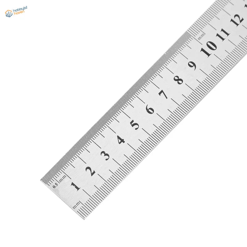 Silver stainless steel ruler with black millimeter markings for precise scale modeling measurements