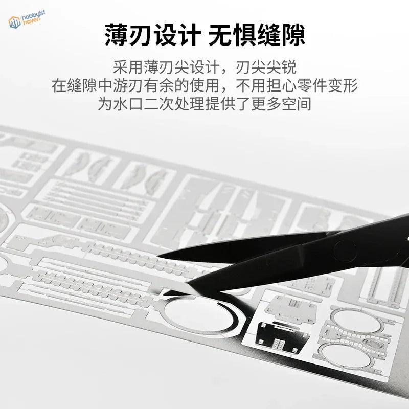 Stainless steel scissors cutting etched translucent silver plastic sheet