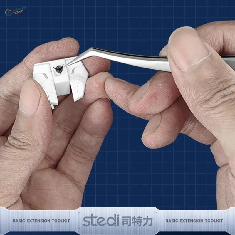 Stedi modelers toolset tweezers handling white plastic kit piece with black emblem