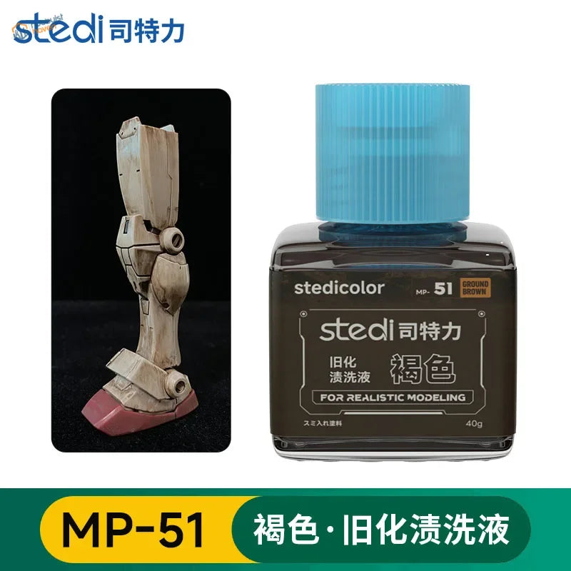 A bottle of stedi weathering wash mp-51 ground brown with a blue ribbed cap and dark label for scale models