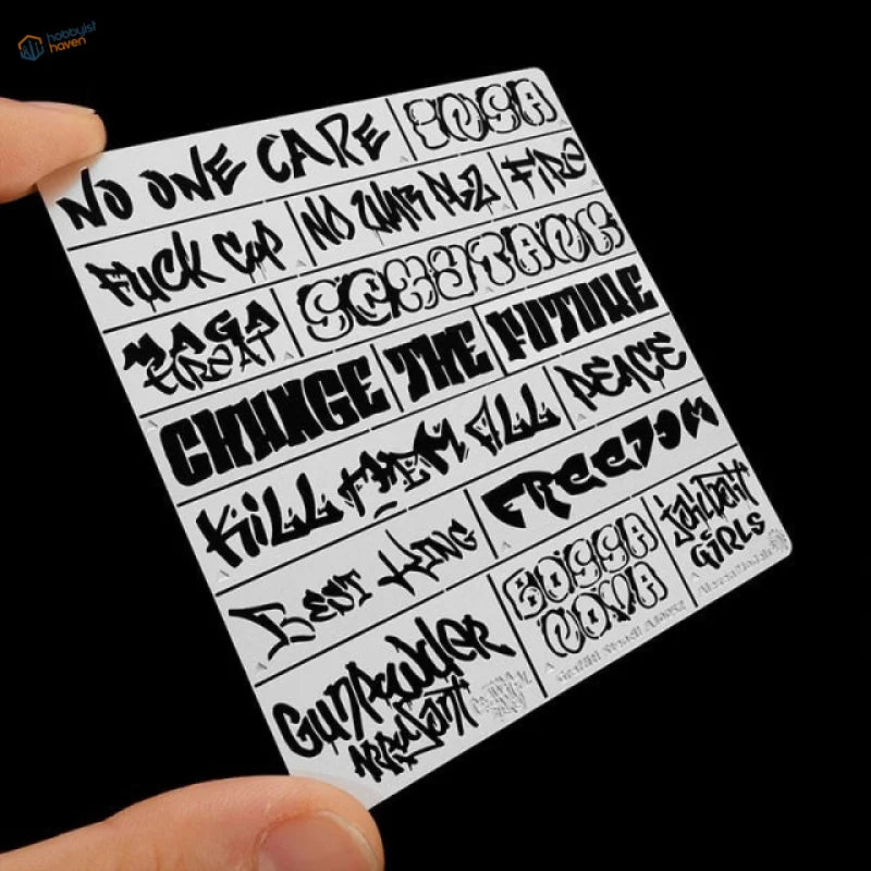White sticker sheet with bold black diorama graffiti for scale modeling tools