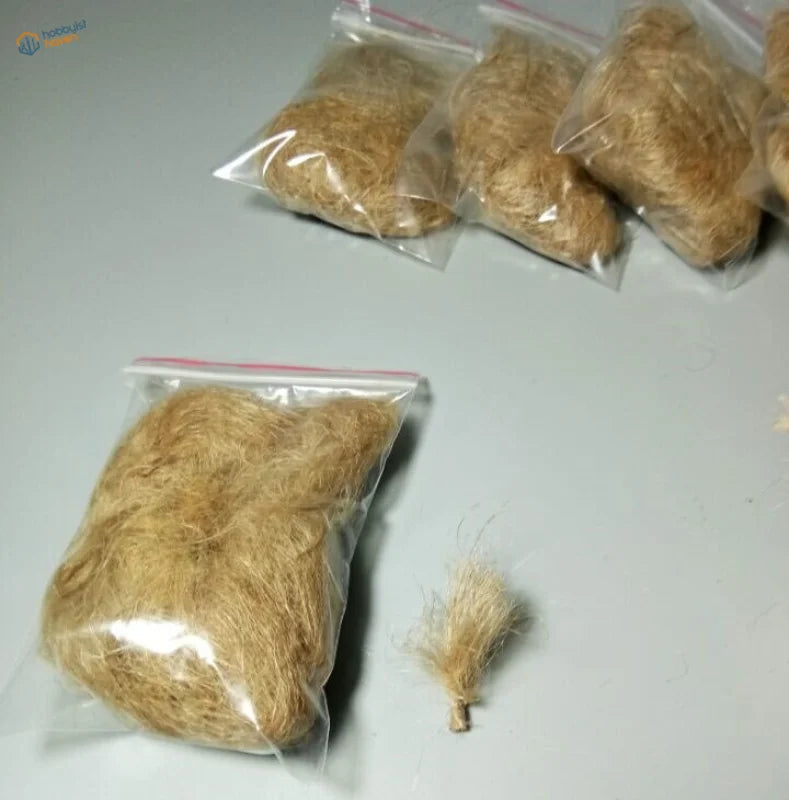 Straw for landscaping: light brown wood fibers yarn in clear bags