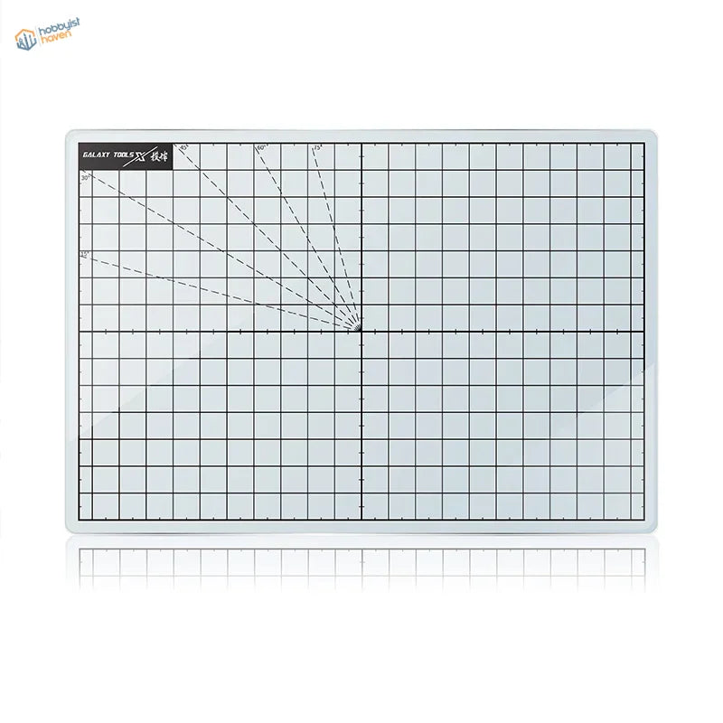 Tempered glass cutting mat with clear grid-lined surface and black markings