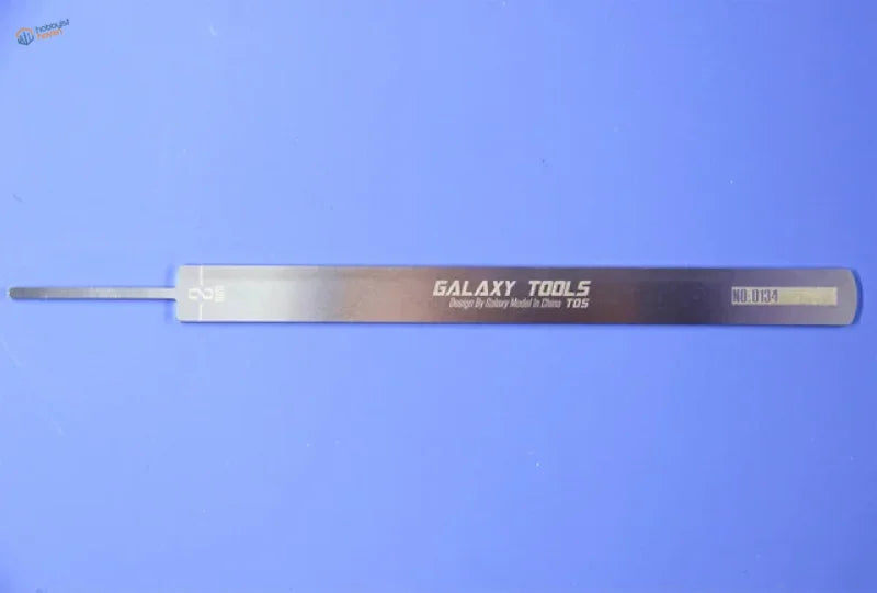 Silver Galaxy Tools stainless steel file for battery removal, back view