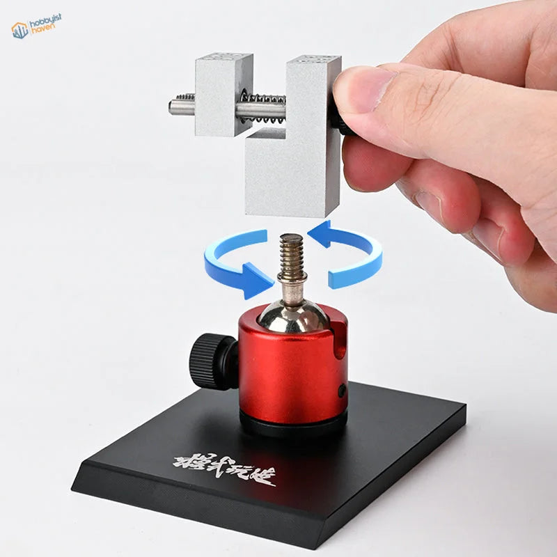 Red aluminium clamp head on the universal ball-joint bench vise
