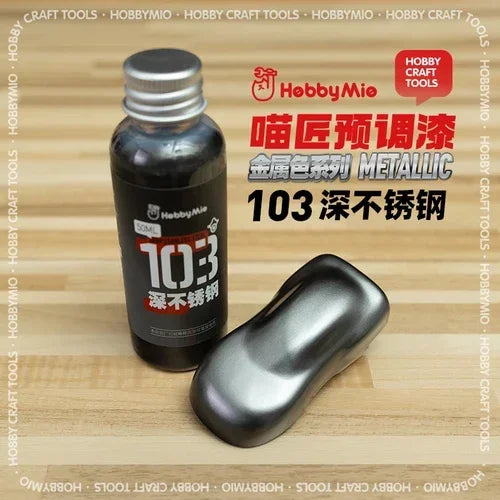 A sleek metallic silver bottle of hobbymie 103 pre-mixed oil-based metallic paint for stainless steel finishes ideal for scale modeling tools