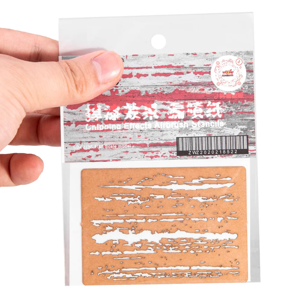 Brown cardboard weathering effects stencil with white brushstrokes for scale modeling