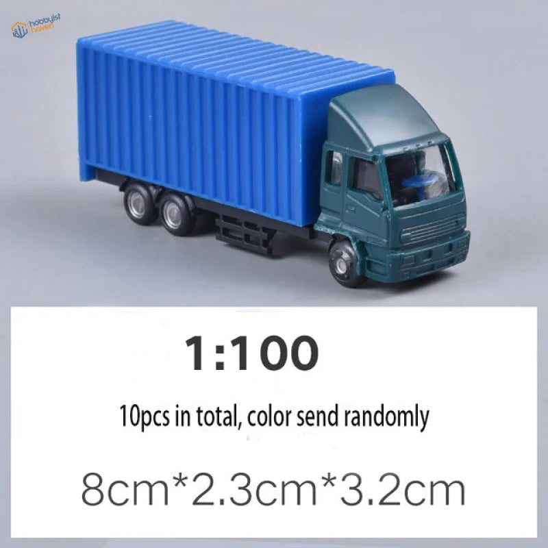Blue and teal 1:100 scale toy truck with ribbed trailer for railway modeling