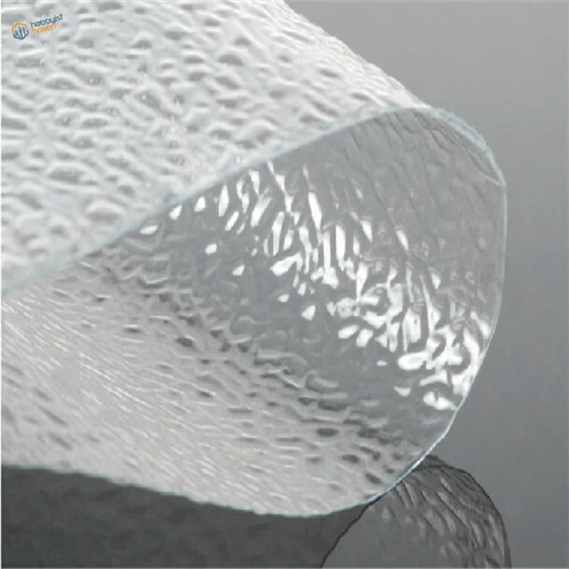 Water simulating transparent PVC sheet with wavy embossed surface