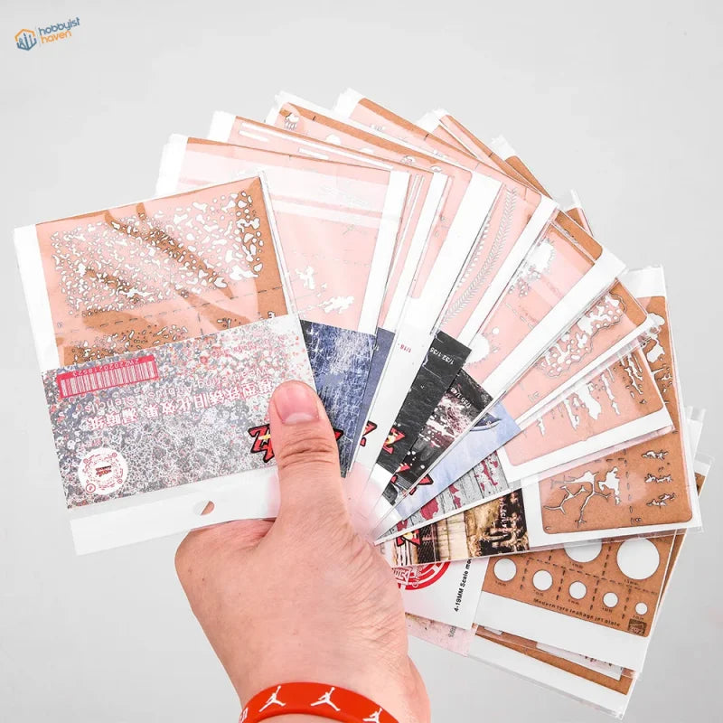 Hand holding Weathering & Effects Stencils with 12 colorful patterns