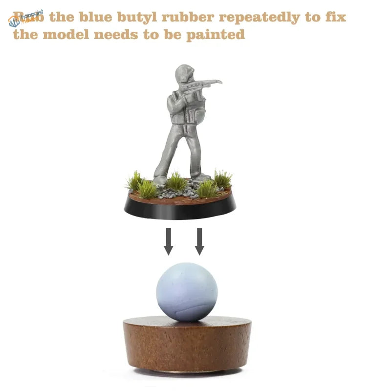 Gray soldier figure on grass base for figure painting with wood handle