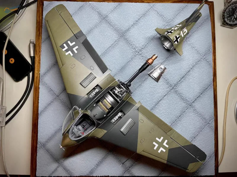 Olive green model airplane on wooden bases for dioramas with gray paint