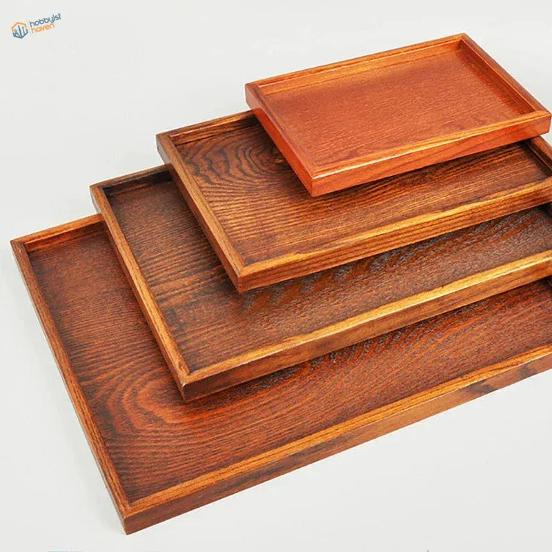 Set of four rectangular wooden bases for dioramas in rich brown tones