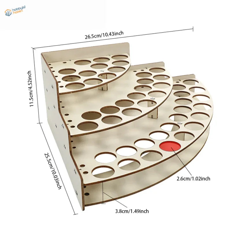 Light-colored wooden multi-tiered paint bottle rack organizer with circular cutouts and red accent for precision hobby tools