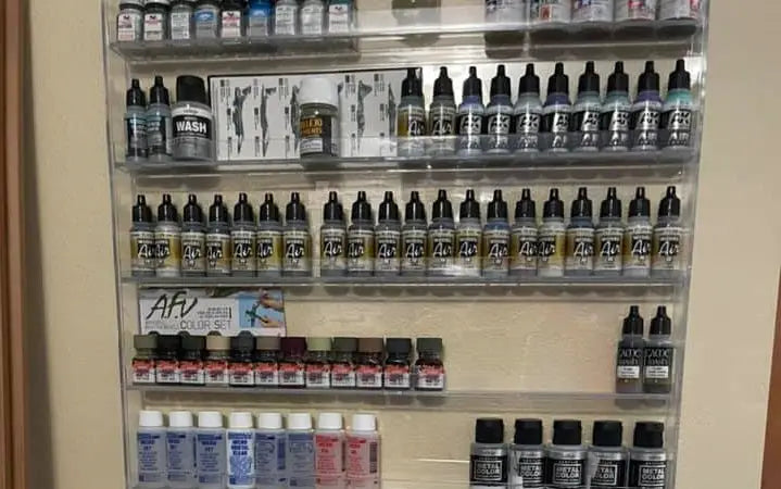 Clear acrylic transparent racks holding afv branded scale modeling tools and miniature painting supplies for gundam kits