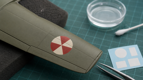 Smooth waterslide decal conforming to the panel lines of a scale model aircraft wing without silvering.