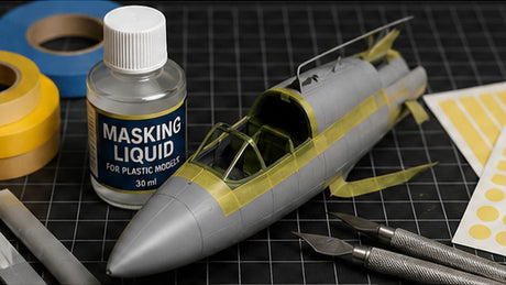 Scale model aircraft canopy and paint areas carefully masked with hobby tape