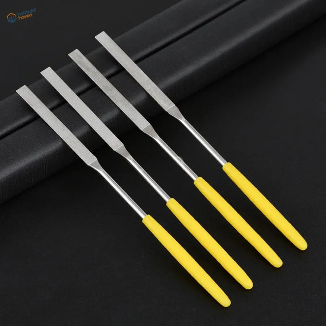 Set of four ultra fine diamond flat file tools with yellow handles