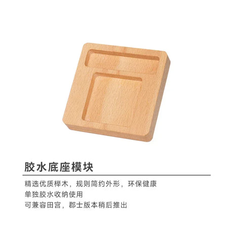 Square wooden glue holder with natural wood grain and recessed compartments