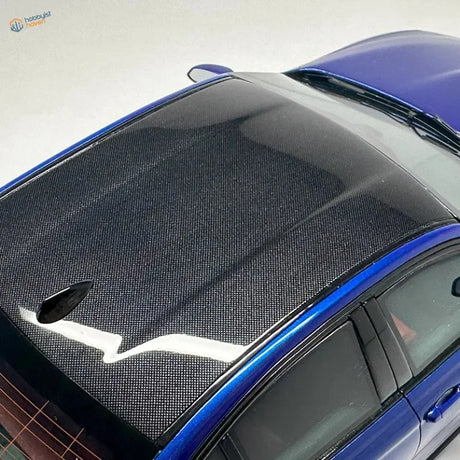 Blue 1/24 scale car with black carbon fiber checkerboard decal roof
