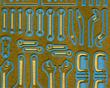 1/35 photoetch garage tools: gold metal cutouts on blue backing
