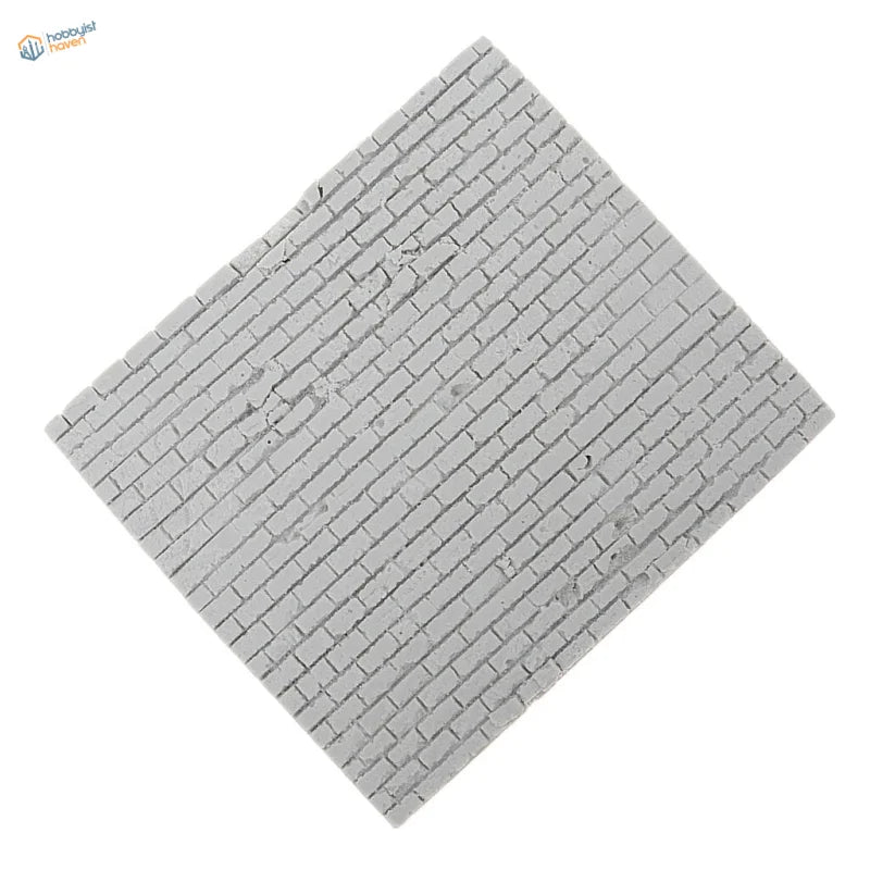 Gray brick-patterned square tile on 1/35 resin brick wall