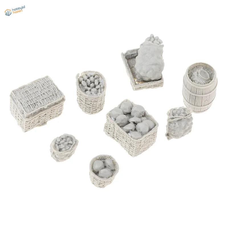 Set of miniature gray wicker baskets and barrels with faux produce.