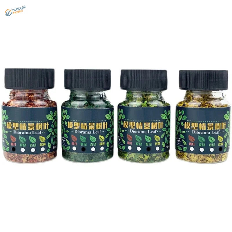Four 1/35-1/48 miniature tree leaves jars in green shades with blue labels