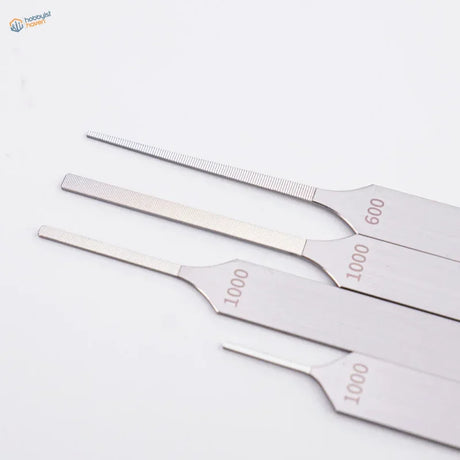 Set of four extra fine stainless steel files marked 1~3mm