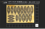 Golden die-cut ostrich fern leaf molds in rows on yellow plate for scale modeling tools