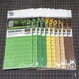 Set of six colorful laser-cut paper leaves in green, yellow, brown pack