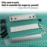 White plastic 1/87 ho scale 40ft flat car kit parts laid out on green cutting mat for model building tools use