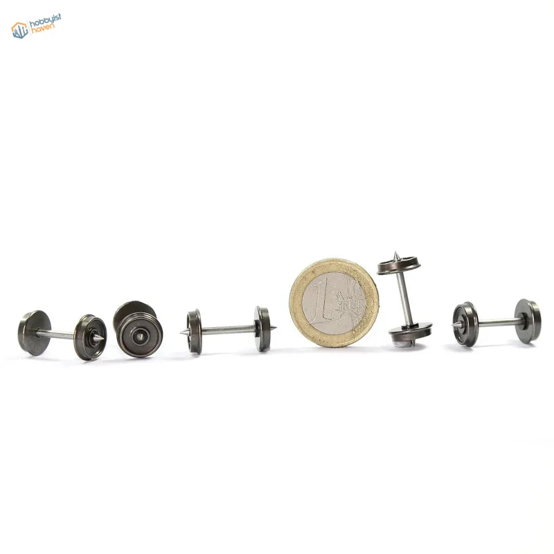 Set of miniature black metal dumbbell-shaped earrings with realistic weight plate details and metallic finish for metal train wheels