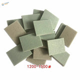 Pile of fine-grit sanding sponges for scale modeling tools