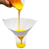 White paper funnel pouring yellow liquid into cup for paint filters